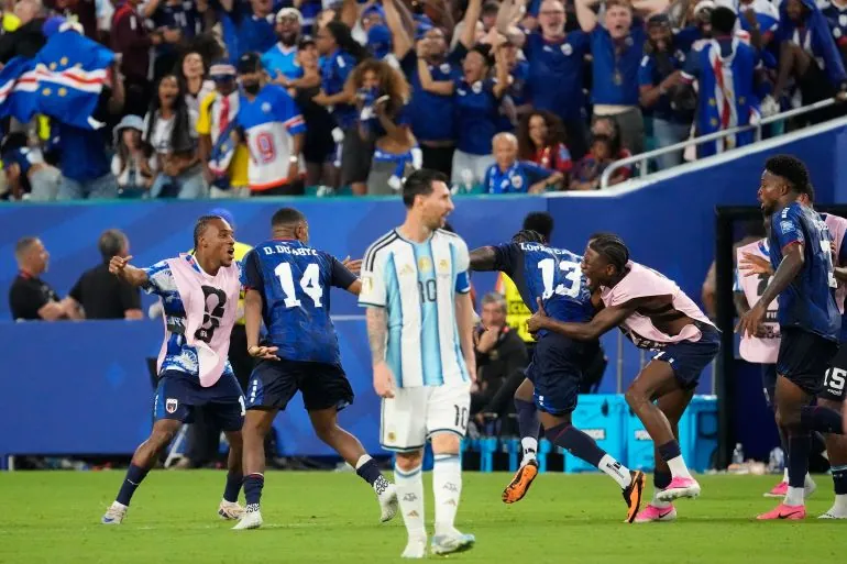 Cape Verde's Sidny Lopes Cabral (13) celebrates with teammates as Argentina's Lionel Messi (10) looks on after scoring their second goal during the World Cup round of 32 soccer match between Argentina and Cape Verde in Miami Gardens, Fla., Friday, July 3, 2026. (AP Photo/Chris Carlson)