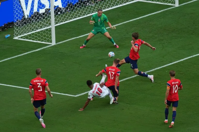 England's Jude Bellingham (10) scores his side's first goal against Norway goalkeeper Oerjan Nyland (1) as Kristoffer Ajer (3), Torbjoern Heggem (17), Sander Berge (8) and Martin Oedegaard (10) help defend on the play during the World Cup quarterfinal soccer match between Norway and England in Miami Gardens, Fla., Saturday, July 11, 2026. (AP Photo/Marta Lavandier)